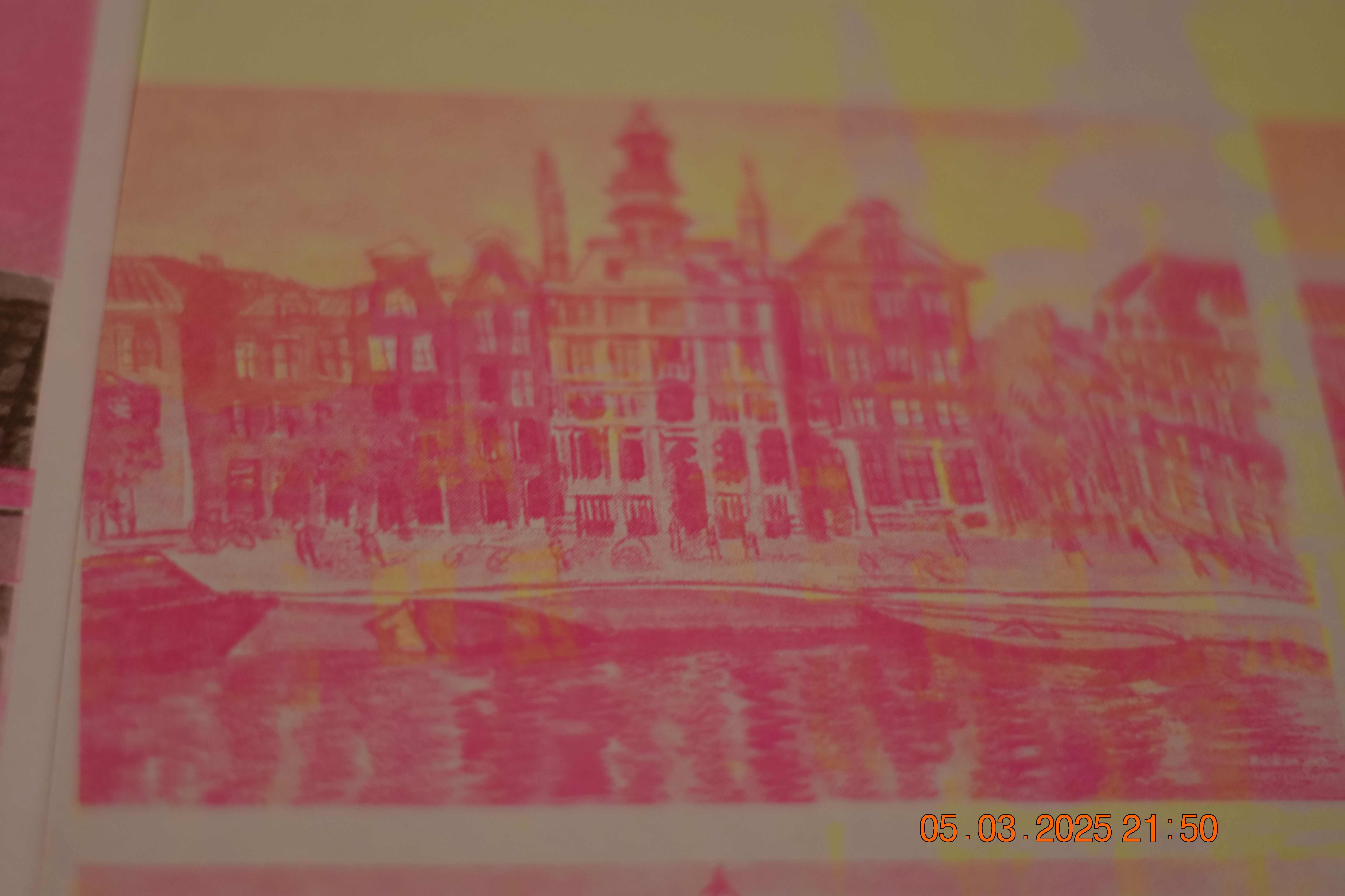 Amsterdam canal houses in pink and orange tones